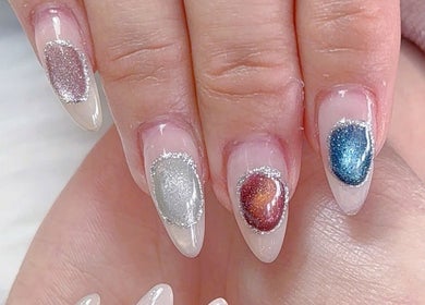 Colorful nail art at Lotus Leaf Beauty Salon, Melbourne, Victoria, AU, showcasing intricate designs.