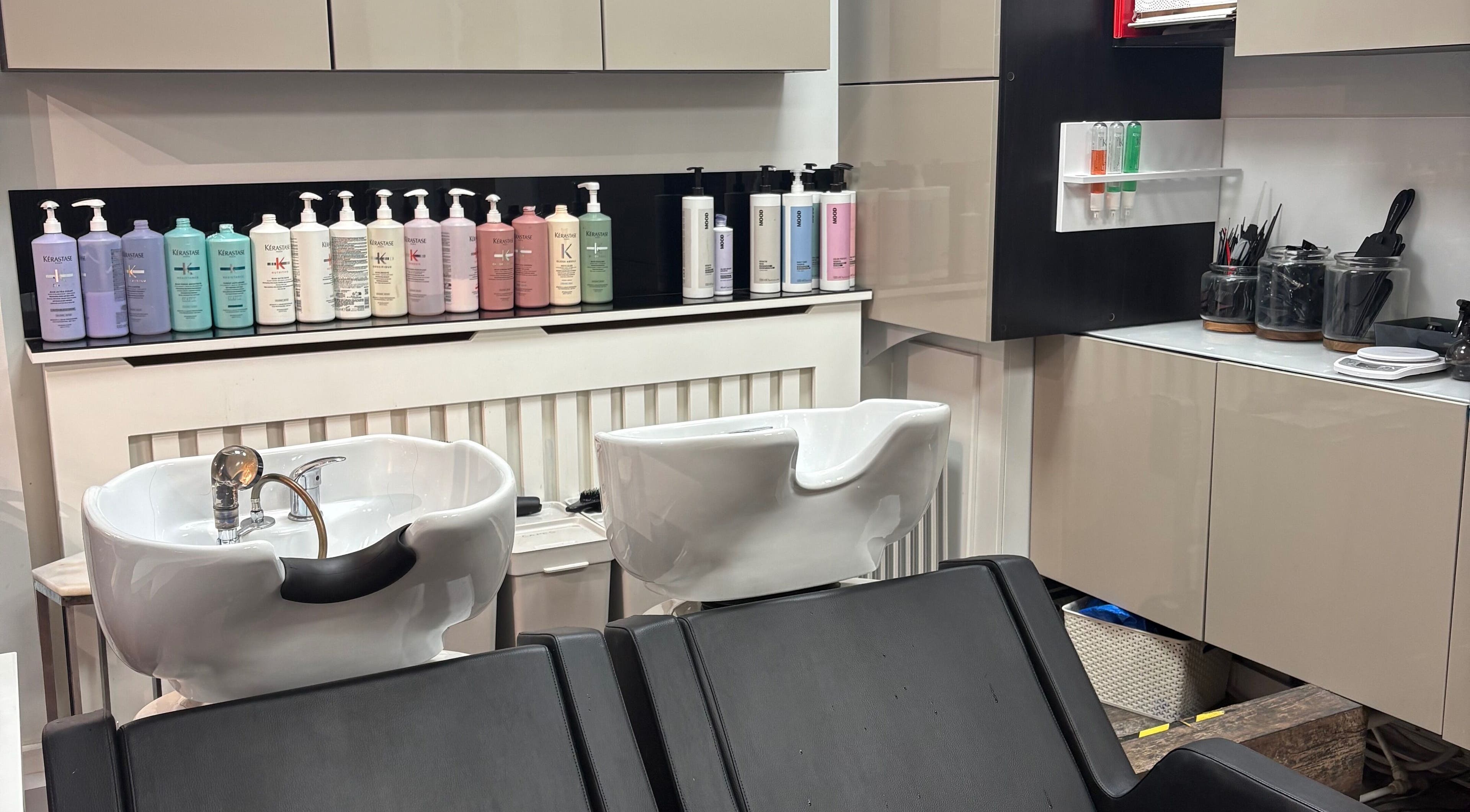 Stylish wash station at Emma Victoria Hair, Stourbridge, England, GB, showcasing premium hair care products.