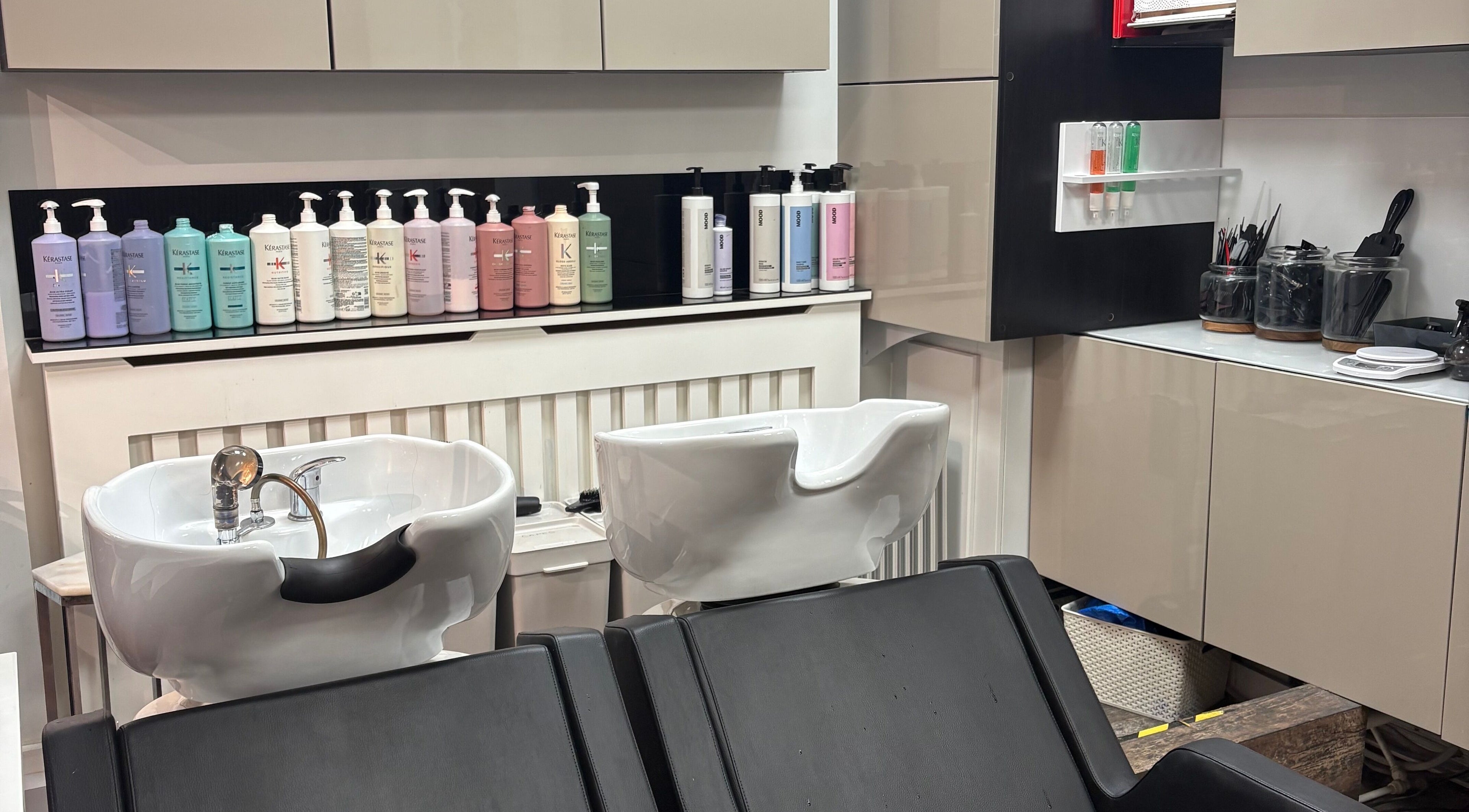 Stylish wash station at Emma Victoria Hair, Stourbridge, England, GB, showcasing premium hair care products.