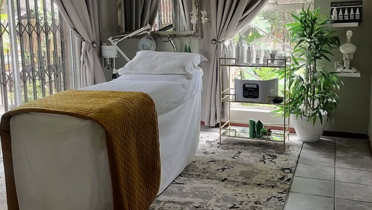 Luxurious treatment room at Rifumo Boutique Spa, Mbombela, Mpumalanga, ZA, with a cozy massage bed.