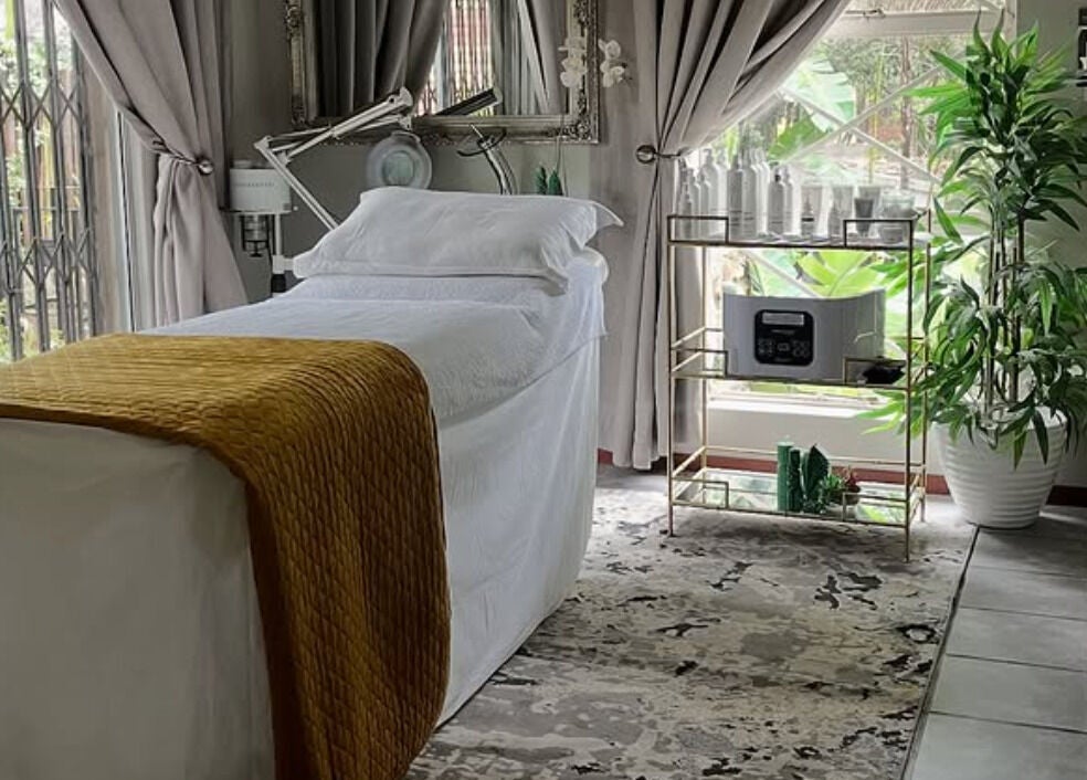 Luxurious treatment room at Rifumo Boutique Spa, Mbombela, Mpumalanga, ZA, with a cozy massage bed.