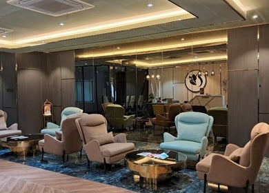 Elegant seating area at Lindo Clinic, Kuala Lumpur, Wilayah Persekutuan Kuala Lumpur, MY with plush chairs and decor.