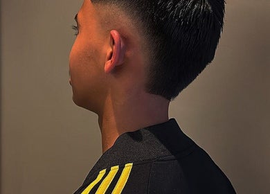 Side view of a fresh fade haircut at Bilscutz, Singapore, SG, showcasing expert styling.