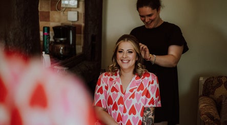 Smiling client in heart-patterned robe at The Healing Head Spa by Amiee Lauren Hairdressing, Leighton Buzzard, England.