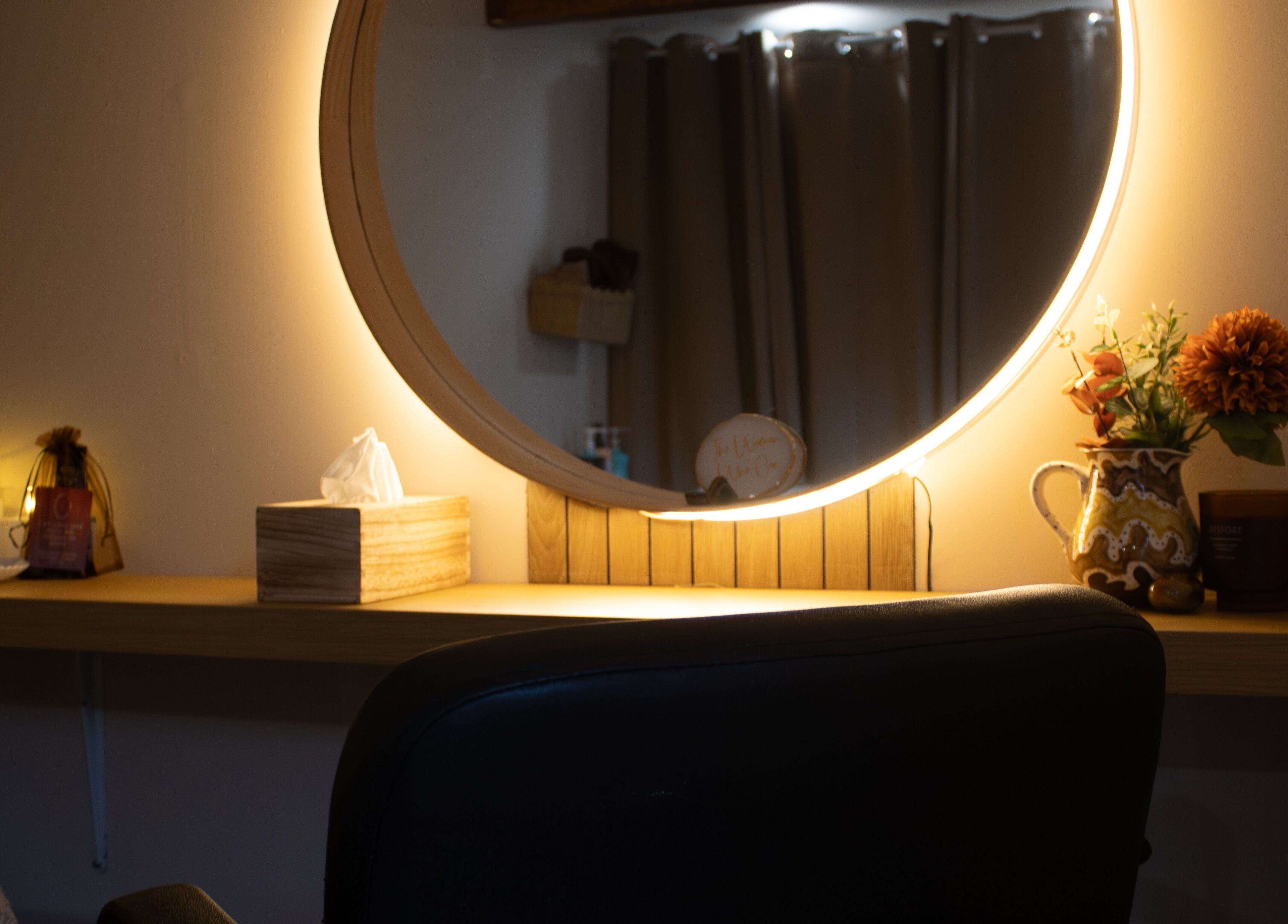 Elegant vanity with mirror at The Healing Head Spa, Leighton Buzzard, England, GB for a calming ambiance.