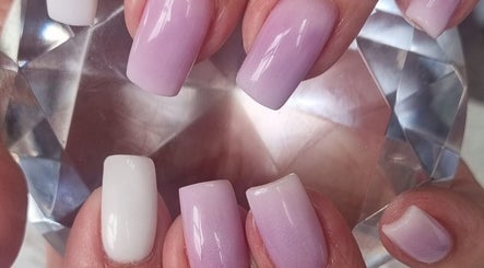 Elegant pink and white ombre nails at Beauty Pro, Vanderbijlpark, Gauteng, ZA, showcasing expert artistry.
