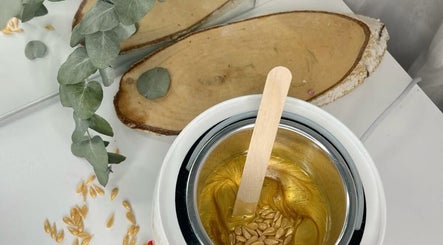 Warming wax at B A R E, Johannesburg, Gauteng, ZA, with eucalyptus for a relaxing spa atmosphere.