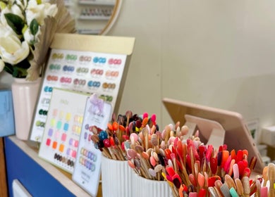 Colorful nail polish swatches on display at Mk & Co Nail in Maroubra, New South Wales, AU.