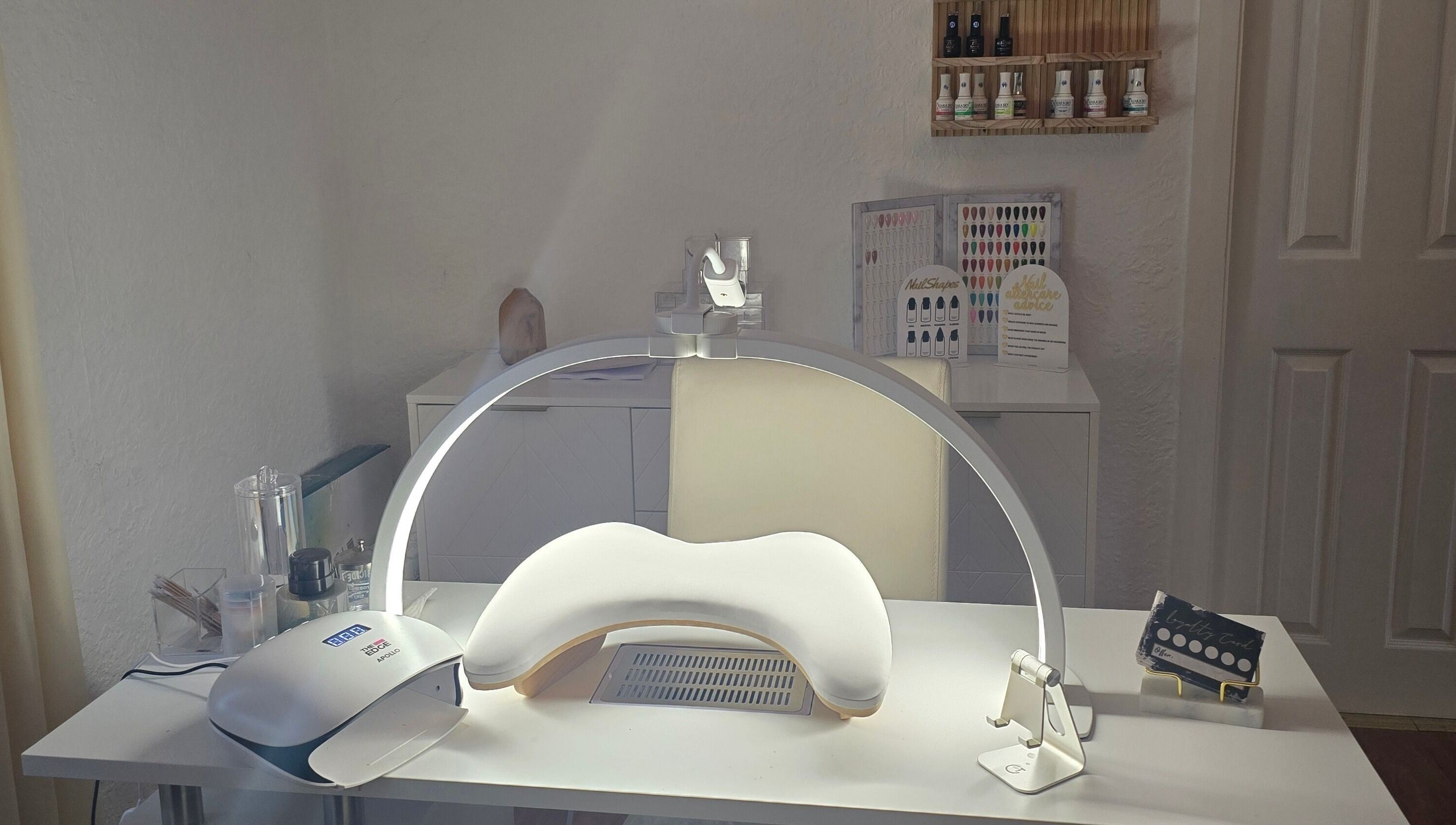 Nail station at Amy's Nailed It in Neyland, Wales, GB, equipped with tools and products for premium beauty care.