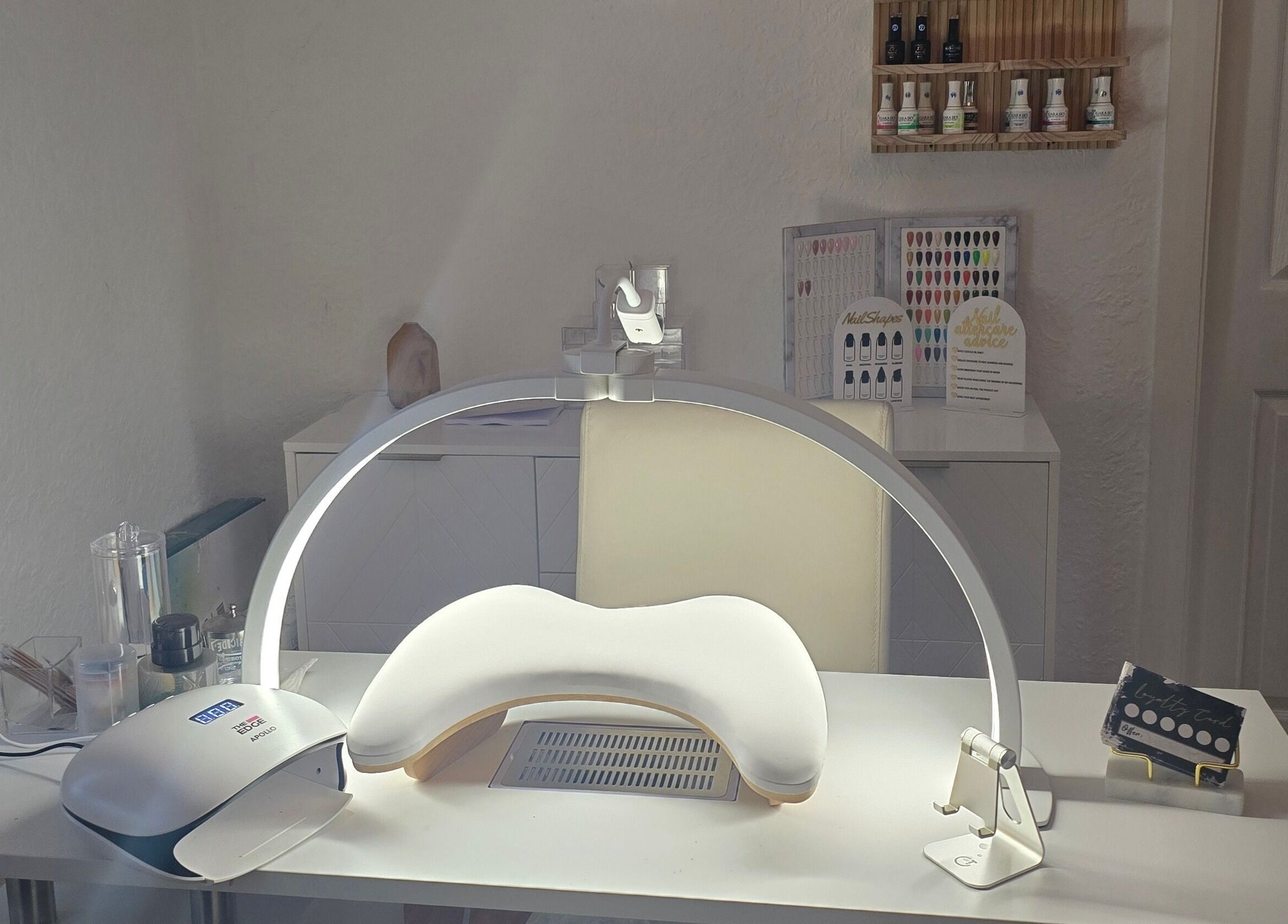 Nail station at Amy's Nailed It in Neyland, Wales, GB, equipped with tools and products for premium beauty care.