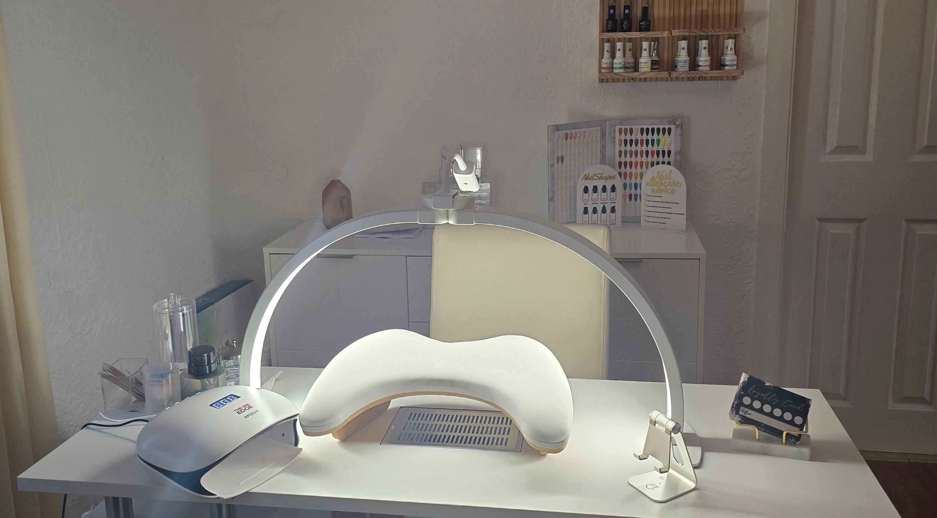 Nail station at Amy's Nailed It in Neyland, Wales, GB, equipped with tools and products for premium beauty care.