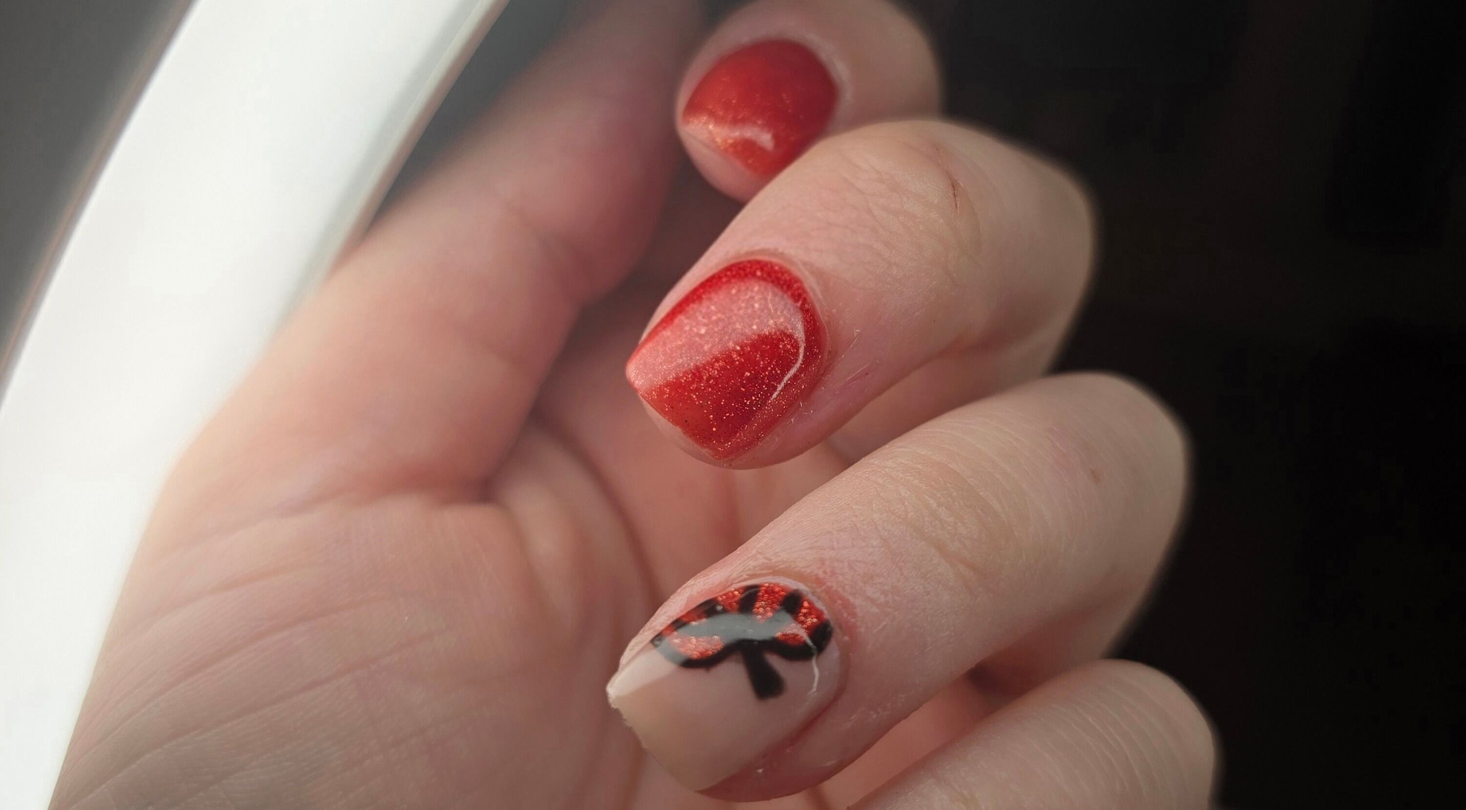 Stunning red nail art at Amy's Nailed It, Neyland, Wales, GB, showcasing intricate design and expert care.