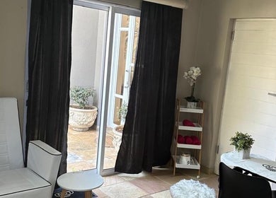 Cozy lounge at Touch Of Heaven Beauty Spa, Pretoria, Gauteng, ZA with white chair and natural light.