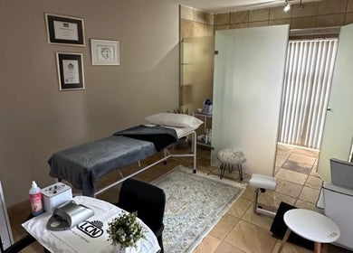 Relaxing treatment room at Touch Of Heaven Beauty Spa in Pretoria, Gauteng, ZA, featuring a cozy massage bed.