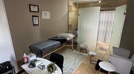 Relaxing treatment room at Touch Of Heaven Beauty Spa in Pretoria, Gauteng, ZA, featuring a cozy massage bed.