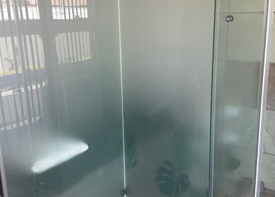 Luxurious shower area at Touch Of Heaven Beauty Spa in Pretoria, Gauteng, ZA, featuring elegant glass doors.