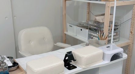 Manicure station at Palette Carys UK in London, England, GB, featuring nail care tools and supplies.