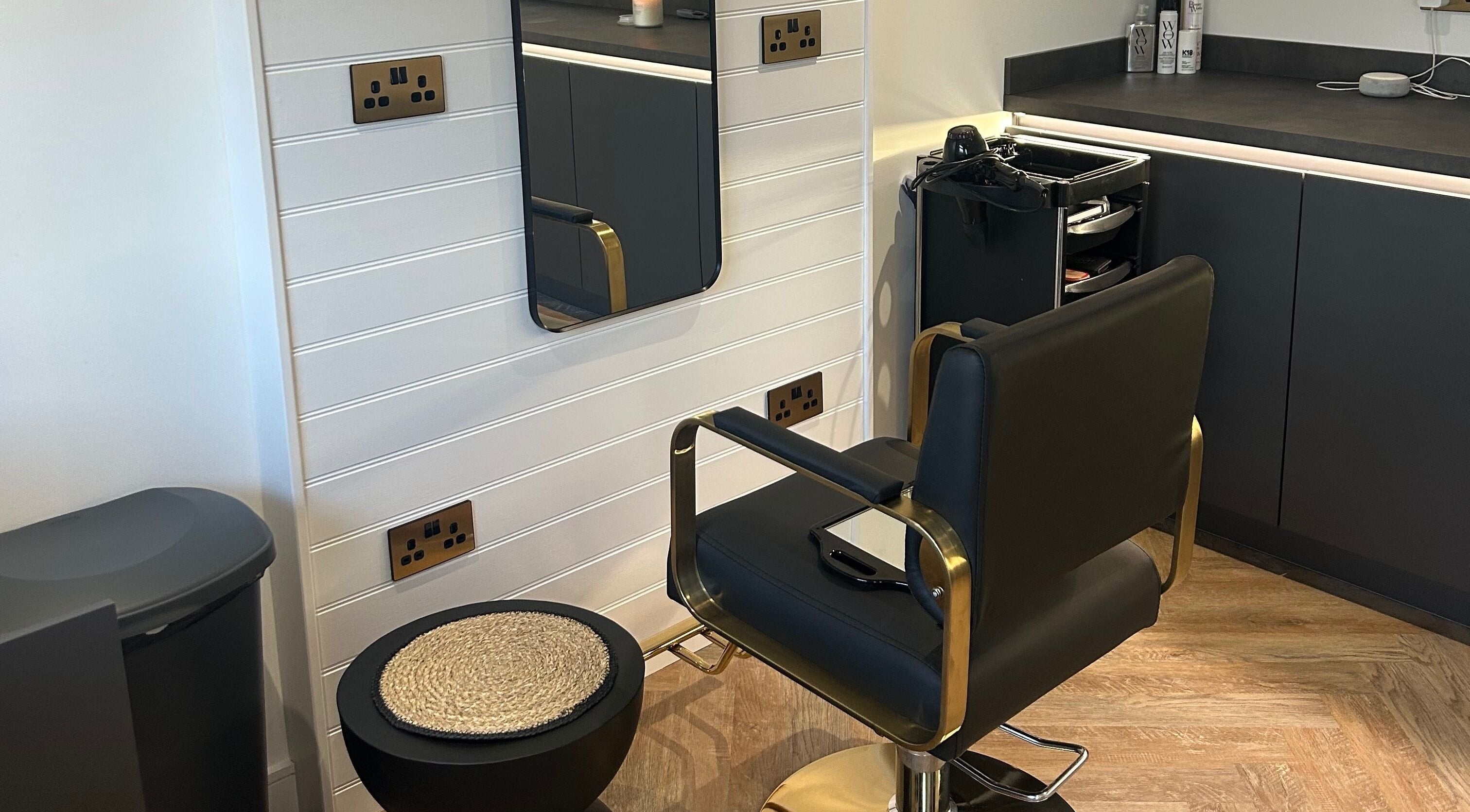 Modern salon chair and styling station at By.Sam in Glasgow, Scotland, GB.