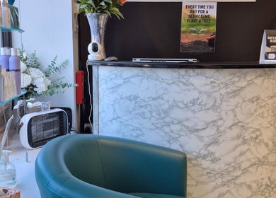 Stylish reception desk at Stephanie O'Keeffe Hair, Cork, County Cork, IE with products and decor.