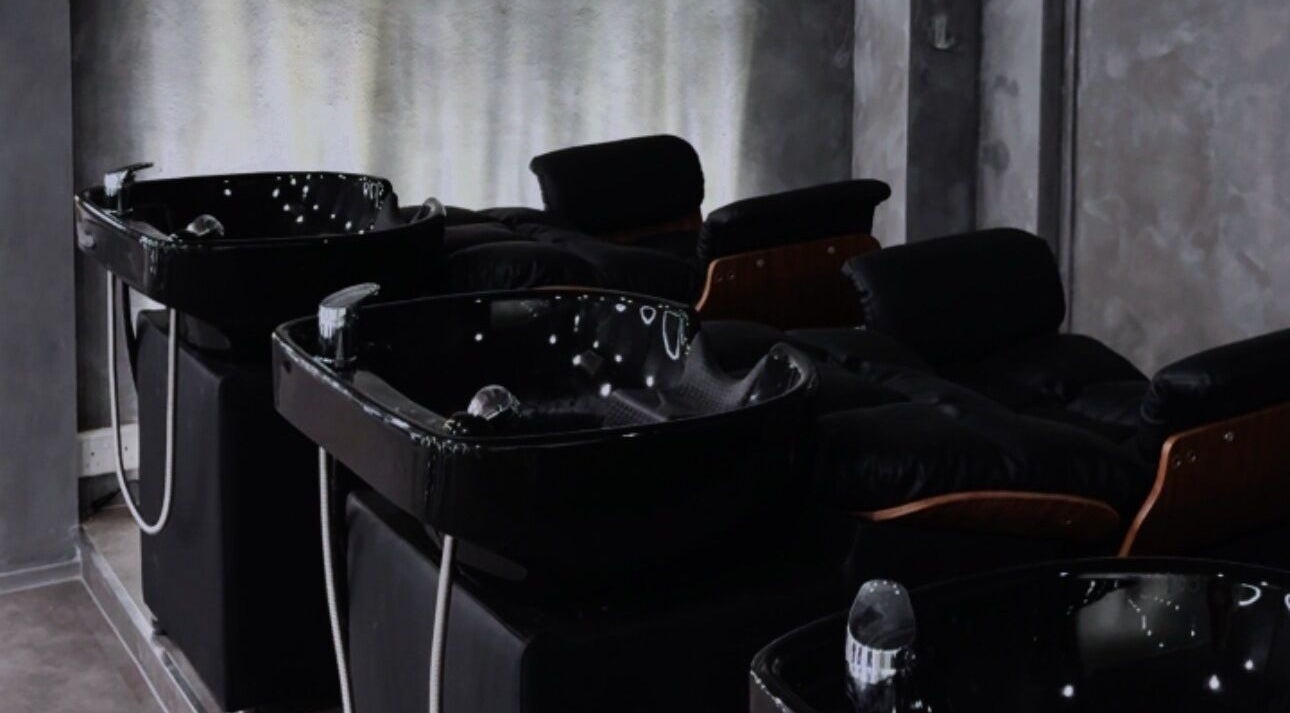 Elegant wash stations at Wu Salon in Singapore, SG, offering premium hair care services.