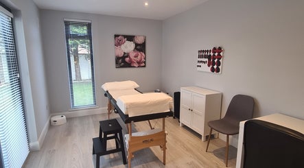 Tranquil therapy room at Reflexology by Laura in Newbridge, County Kildare, IE featuring massage tables.