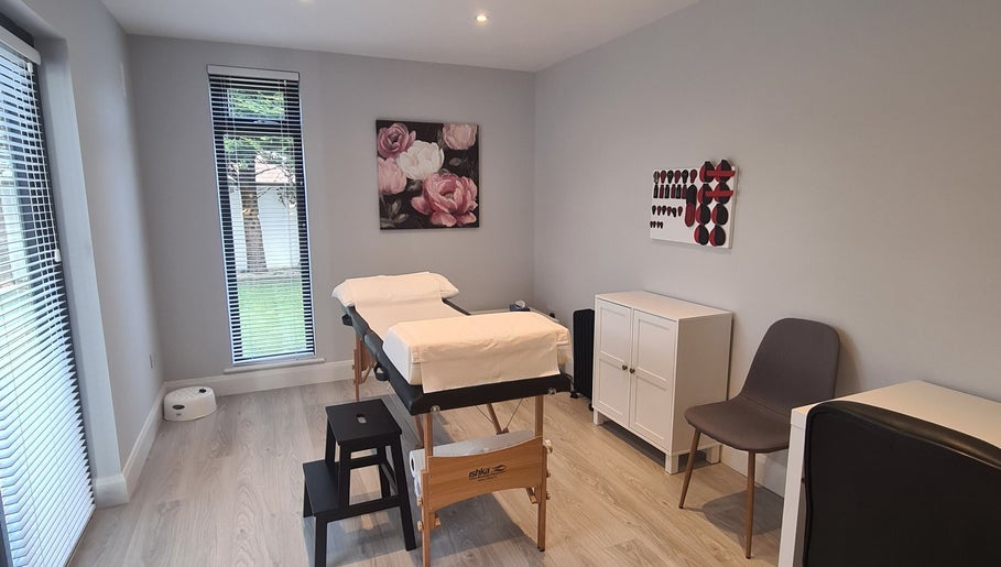 Tranquil massage room at Reflexology by Laura in Newbridge, County Kildare, IE featuring soothing decor.