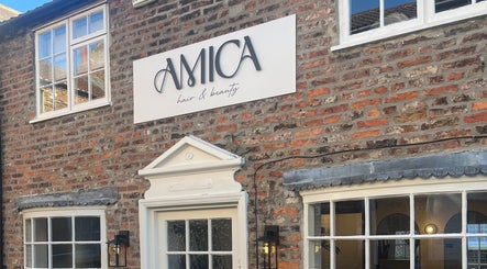 Amica Hair & Beauty Thirsk facade with elegant sign, Thirsk, England, GB.