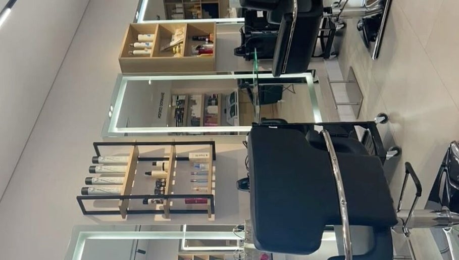 Chic interior of Hair by 0lixiaa in Glasgow, Scotland, GB, showcasing modern styling stations.
