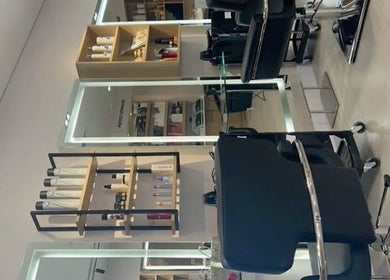Chic interior of Hair by 0lixiaa in Glasgow, Scotland, GB, showcasing modern styling stations.