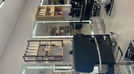 Chic interior of Hair by 0lixiaa in Glasgow, Scotland, GB, showcasing modern styling stations.