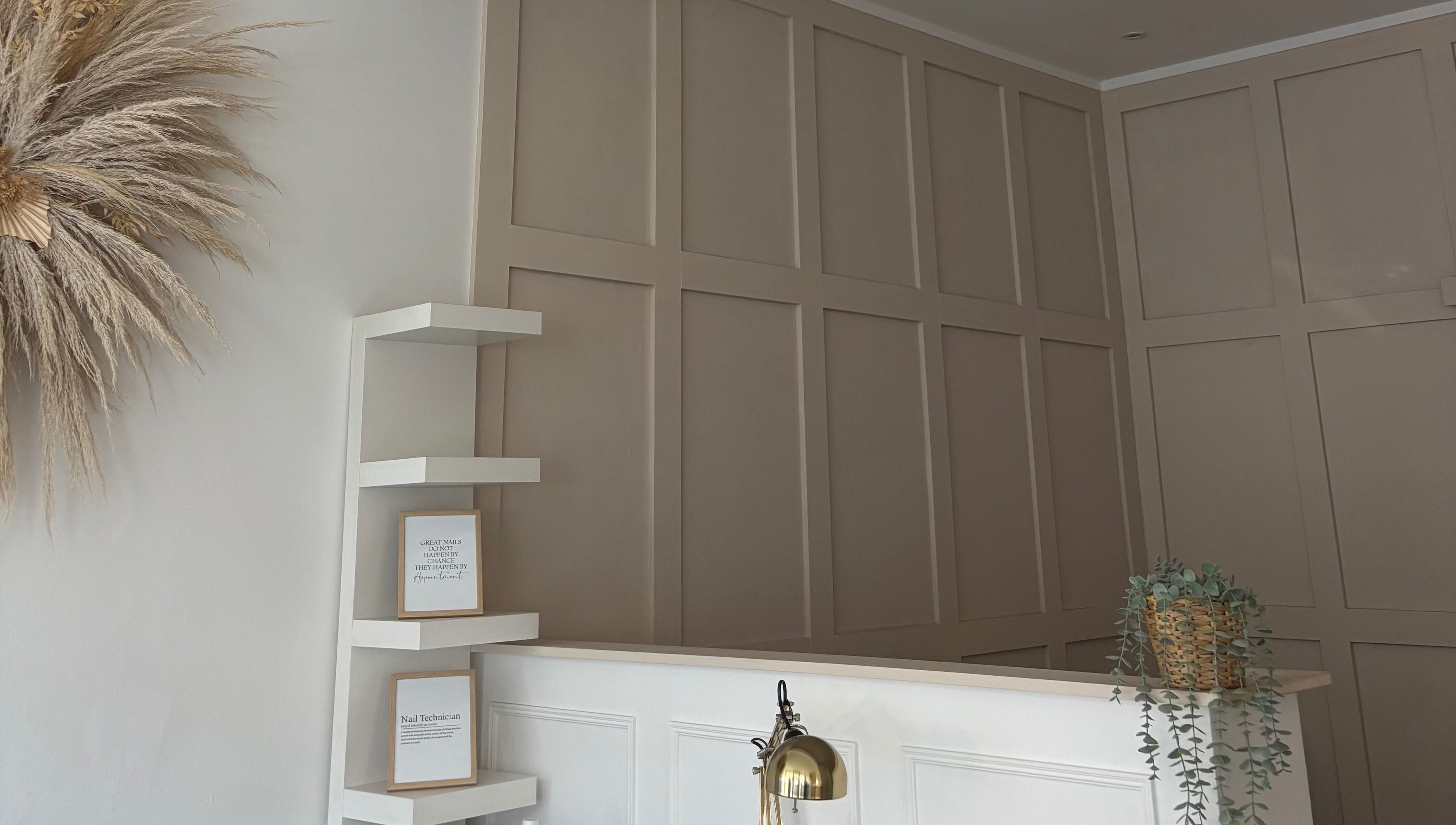 Elegant reception with pampas decor and shelving at KB Beauty Room, Senghenydd, Wales, GB.