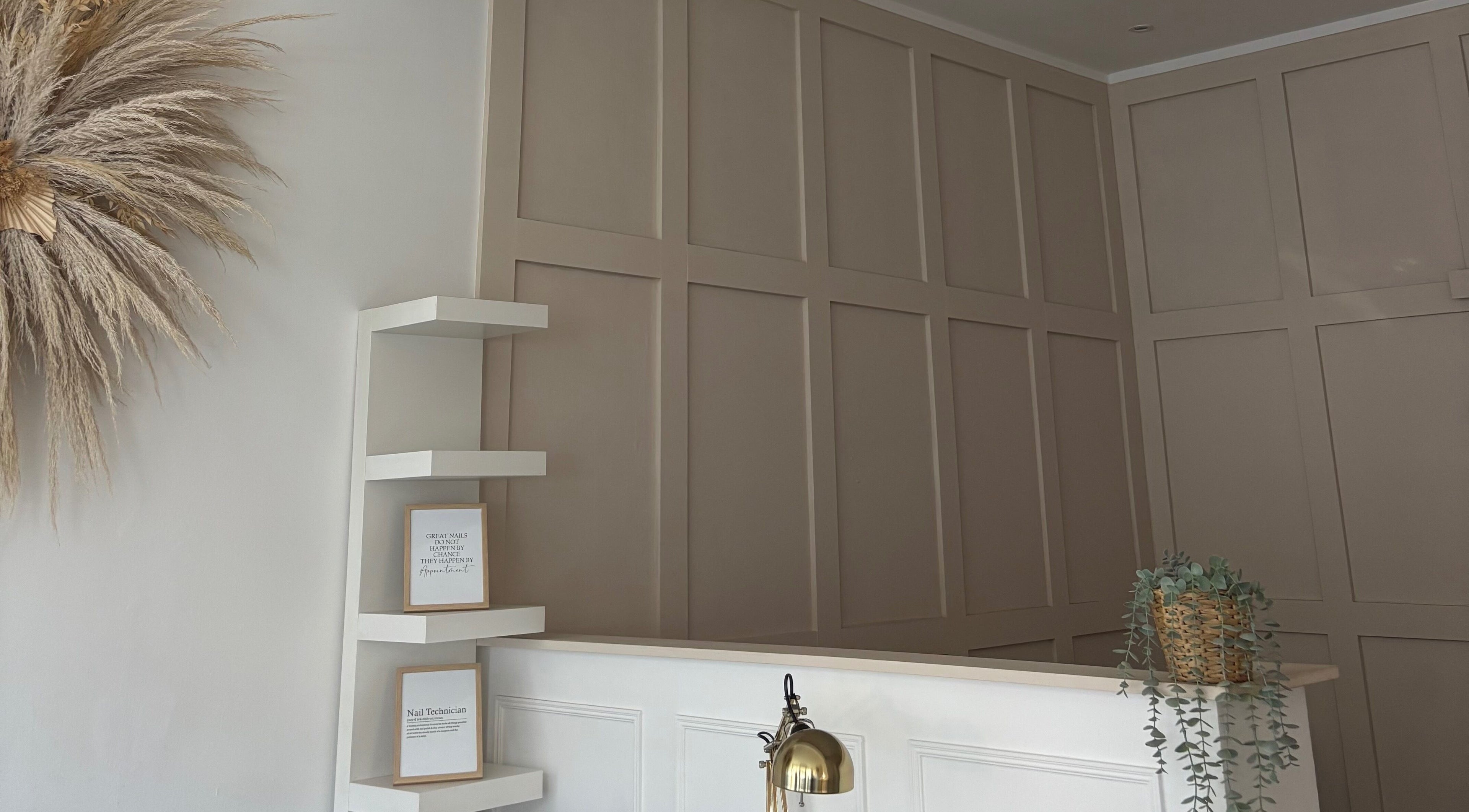 Elegant reception with pampas decor and shelving at KB Beauty Room, Senghenydd, Wales, GB.