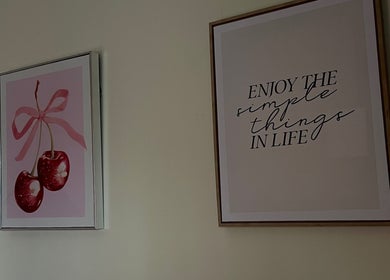 Decorative wall art with cherries and quote at Eves Lash Studio, Portadown, Northern Ireland, GB.