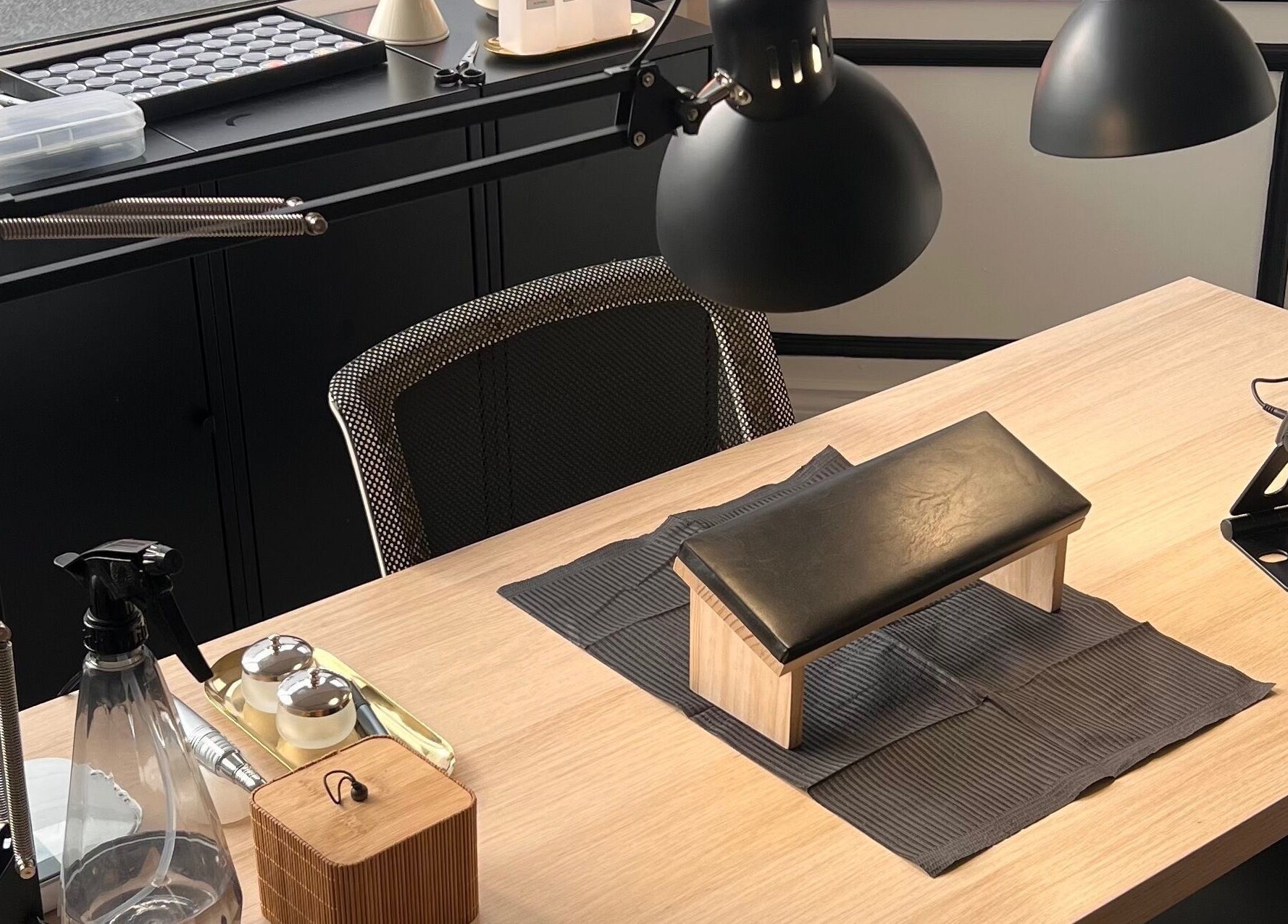 Professional nail station setup at ChristianShS, Stockport, England, GB, with tools and lighting.