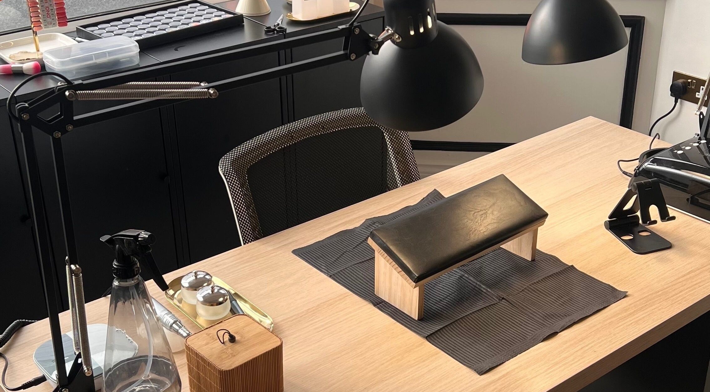 Professional nail station setup at ChristianShS, Stockport, England, GB, with tools and lighting.