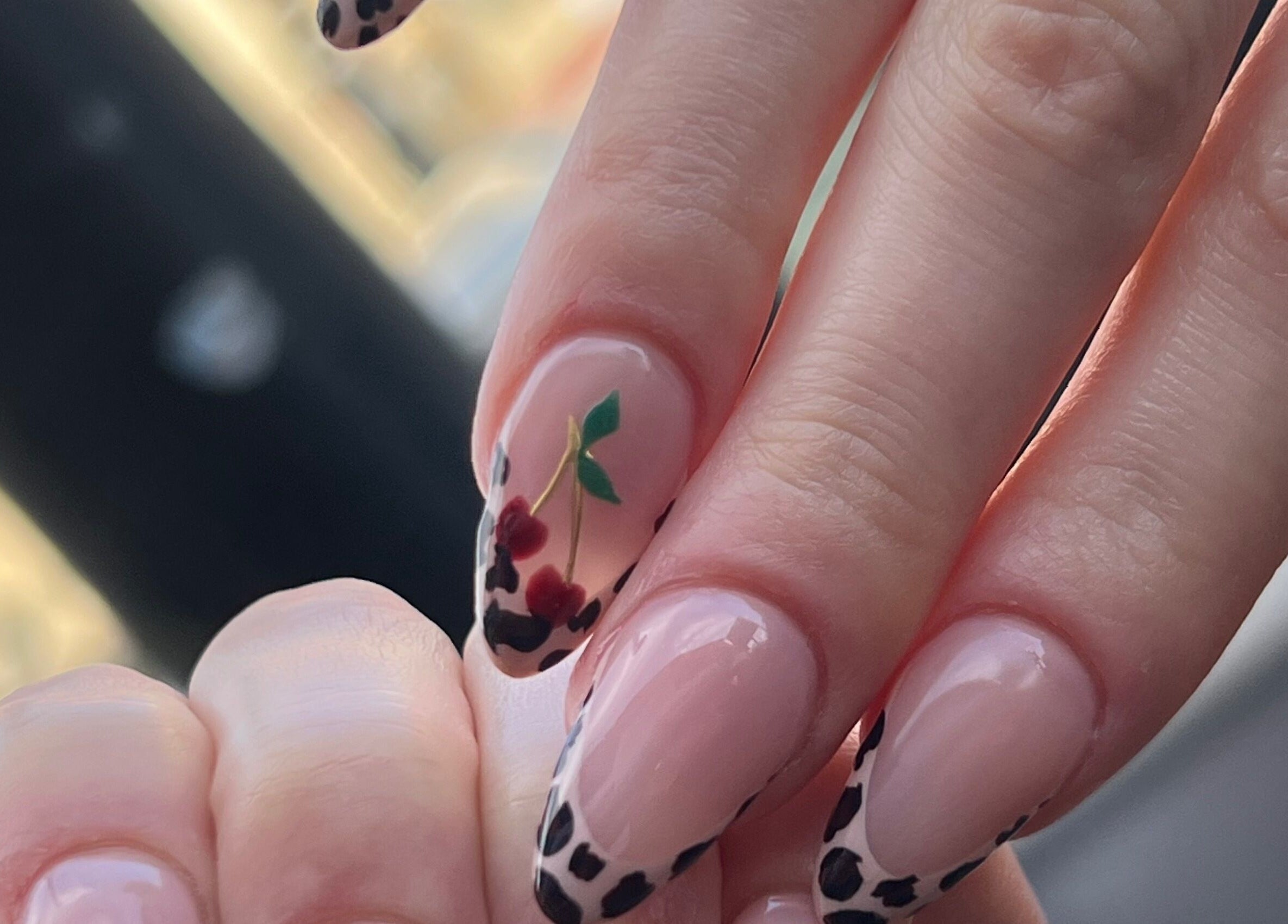 Cherry and leopard print nails designed at ChristianShS, Stockport, England, GB.