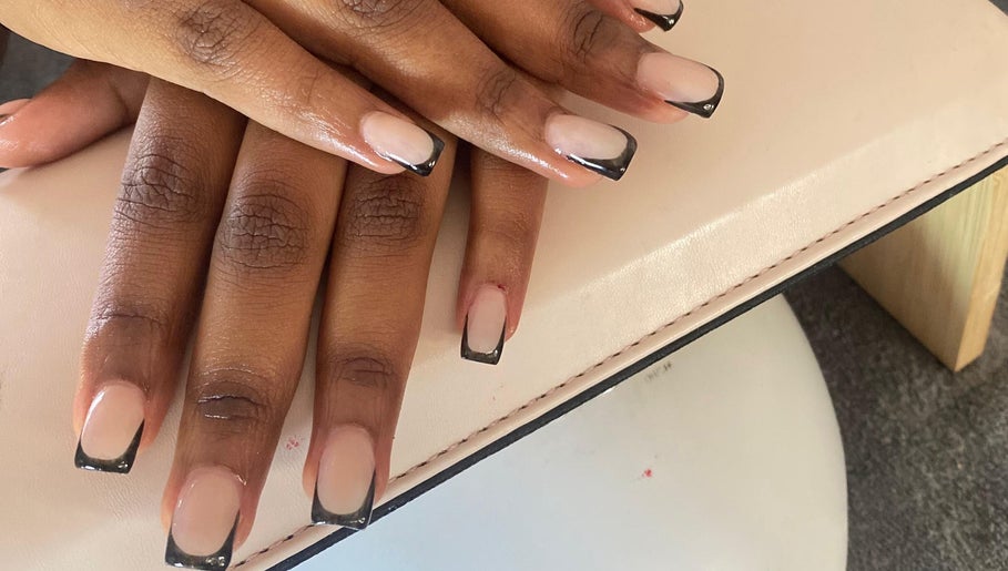 Stylish black French manicure at Kay's Beauty & Nails, Vosloorus, Gauteng, ZA.