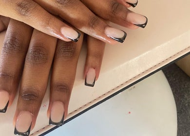 Stylish black French manicure at Kay's Beauty & Nails, Vosloorus, Gauteng, ZA.