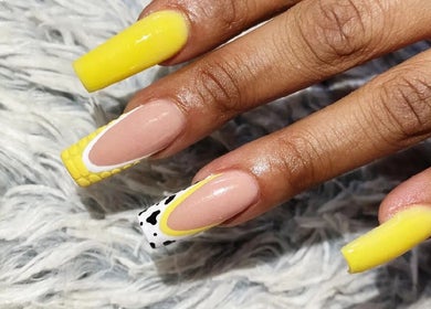Stunning yellow and black nail art at Kay's Beauty & Nails, Vosloorus, Gauteng, ZA.
