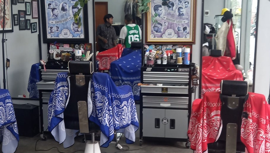 Stylish barbershop interior at Haircut by Ronii_moo in Bali, Bali, ID with colorful chairs and grooming tools.