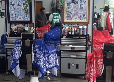 Stylish barbershop interior at Haircut by Ronii_moo in Bali, Bali, ID with colorful chairs and grooming tools.