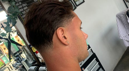 Profile view of a sleek tapered haircut at Haircut by Ronii_moo, Bali, Bali, ID.