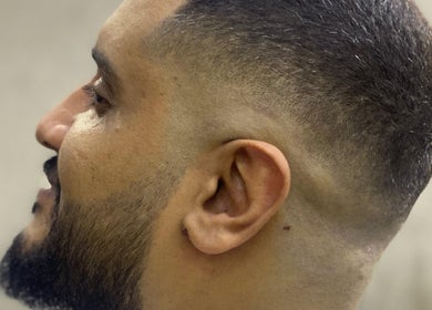 Close-up of a sharp fade haircut by Ronii_moo at Bali, Bali, ID, showcasing expert barber skills.
