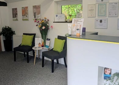 Reception area of Zoë-Erika Massage and Reiki, Haywards Heath, England, GB, with chairs and decor.