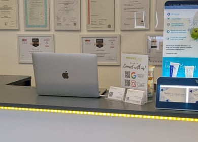 Reception area at Zoë-Erika Massage and Reiki, Haywards Heath, England, GB featuring certificates and promotional materials.