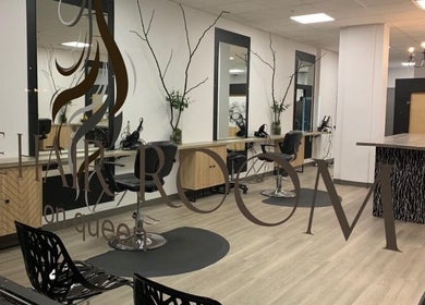 Modern salon interior at Created By Ailee in Sault Ste. Marie, Ontario, CA, showcasing elegant styling stations.