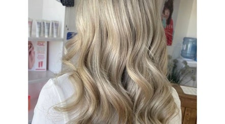 Elegant blonde curls styled at LJ hairdressing, Cowplain, England, GB with premium care products.