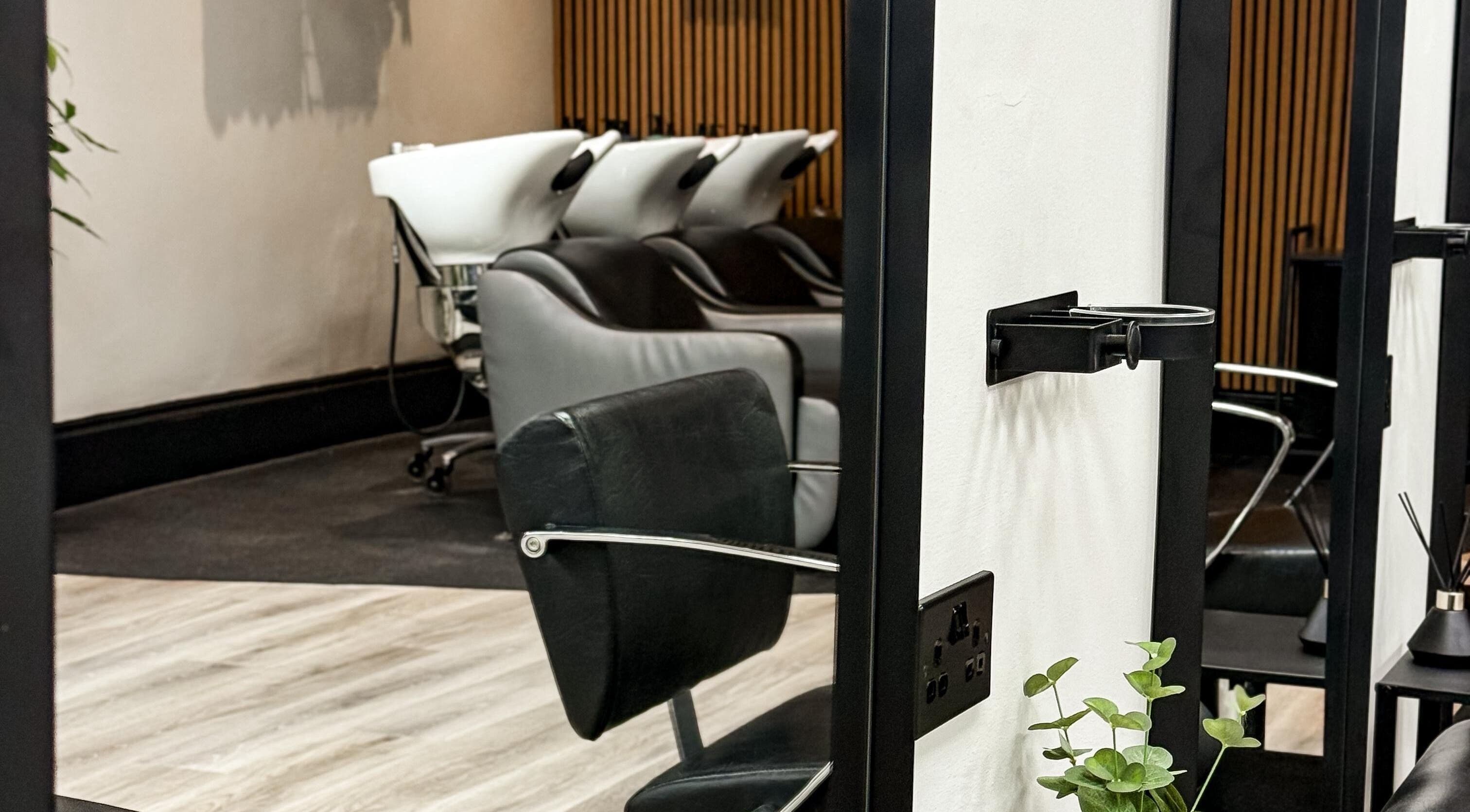 Modern salon chairs and washing stations at LJ Hairdressing in Cowplain, England, GB.