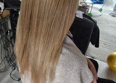Woman with silky, straight blonde hair at Annabel Hair, Sandbach, England, GB salon.