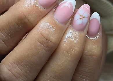 Elegant pink manicure with floral accents at ER nails, Worsley, England, GB.